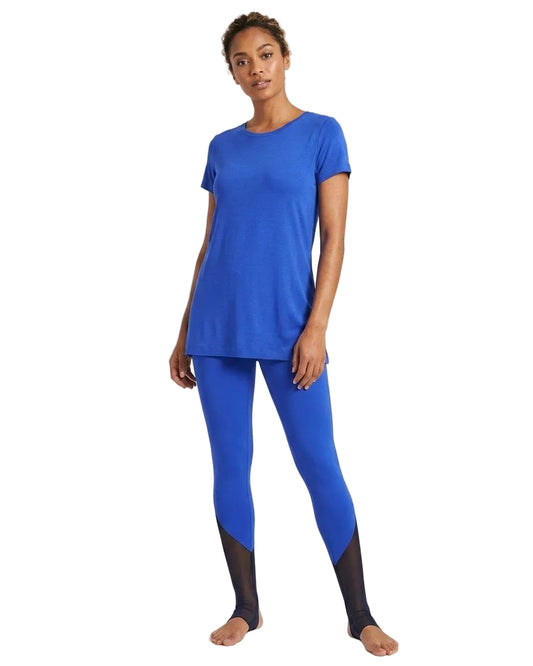 Woman wearing a blue athletic outfit on a white background